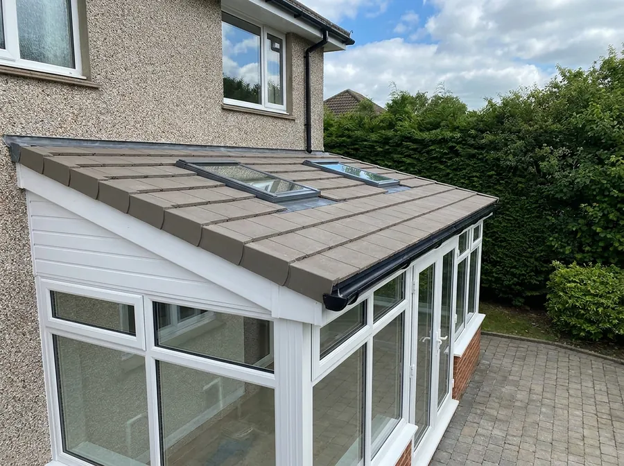 Insulated conservatory roof with two flush roof windows